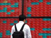 Explore effective strategies for navigating the global market live amidst economic fluctuations and technological advancements (image.cnbcfm.com).