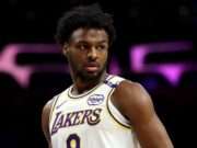 Explore Bronny James' journey in the G League, showcasing his performances, challenges, and growth as he follows in his father's footsteps (s.yimg.com).