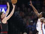 Shai Gilgeous-Alexander leads the Thunder to victory over the Bulls in a thrilling NBA matchup, showcasing his remarkable skills and team chemistry. Image courtesy (s.yimg.com)