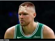 Explore Kristaps Porziņģis's resilience after his injury during playoff game against the Magic, showcasing his strength and determination. Image courtesy (jb-optimus.s3.ap-south-1.amazonaws.com)