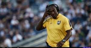An exploration of Kenni Burns' dismissal from Kent State due to ethics violations and financial issues (s.yimg.com).